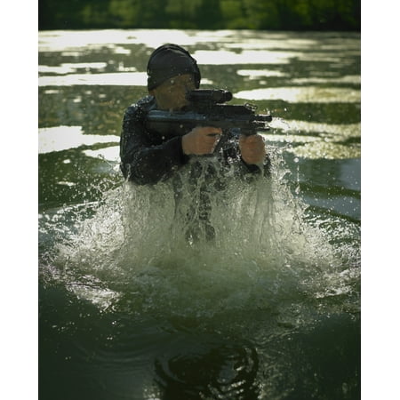 Special operations forces soldier emerges from water armed with a Steyr AUG assault rifle Poster (Best Special Forces Assault Rifle)