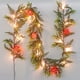 thumbnail image 1 of Guirnalda navideña CCINEE de 1,8 m con luces y 20 LED que funciona con pilas, 1 of 8