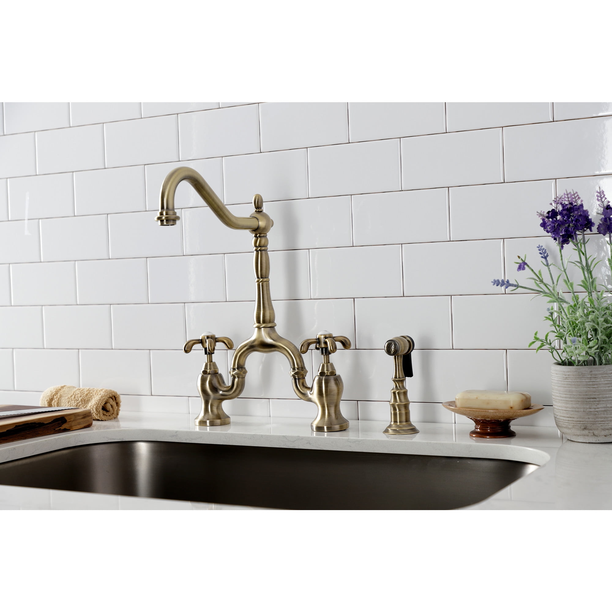 Kingston Brass KS7753TXBS French Country Two-Handle 3-Hole Deck Mount Bridge Kitchen Faucet with Brass Side Sprayer in Antique Brass