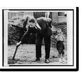 thumbnail image 2 of Historic Framed Print, [Martin Luther King, Jr., pulls up cross that was burned on lawn of his home, as his son stands next to him, Atlanta, Georgia], 17-7/8" x 21-7/8", 2 of 9