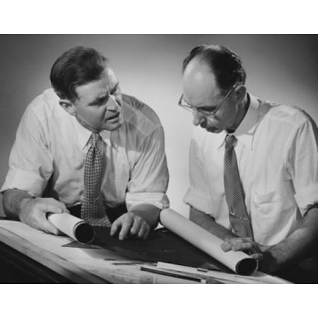 - Two architects discussing a blueprint Stretched Canvas - (18 x 24)