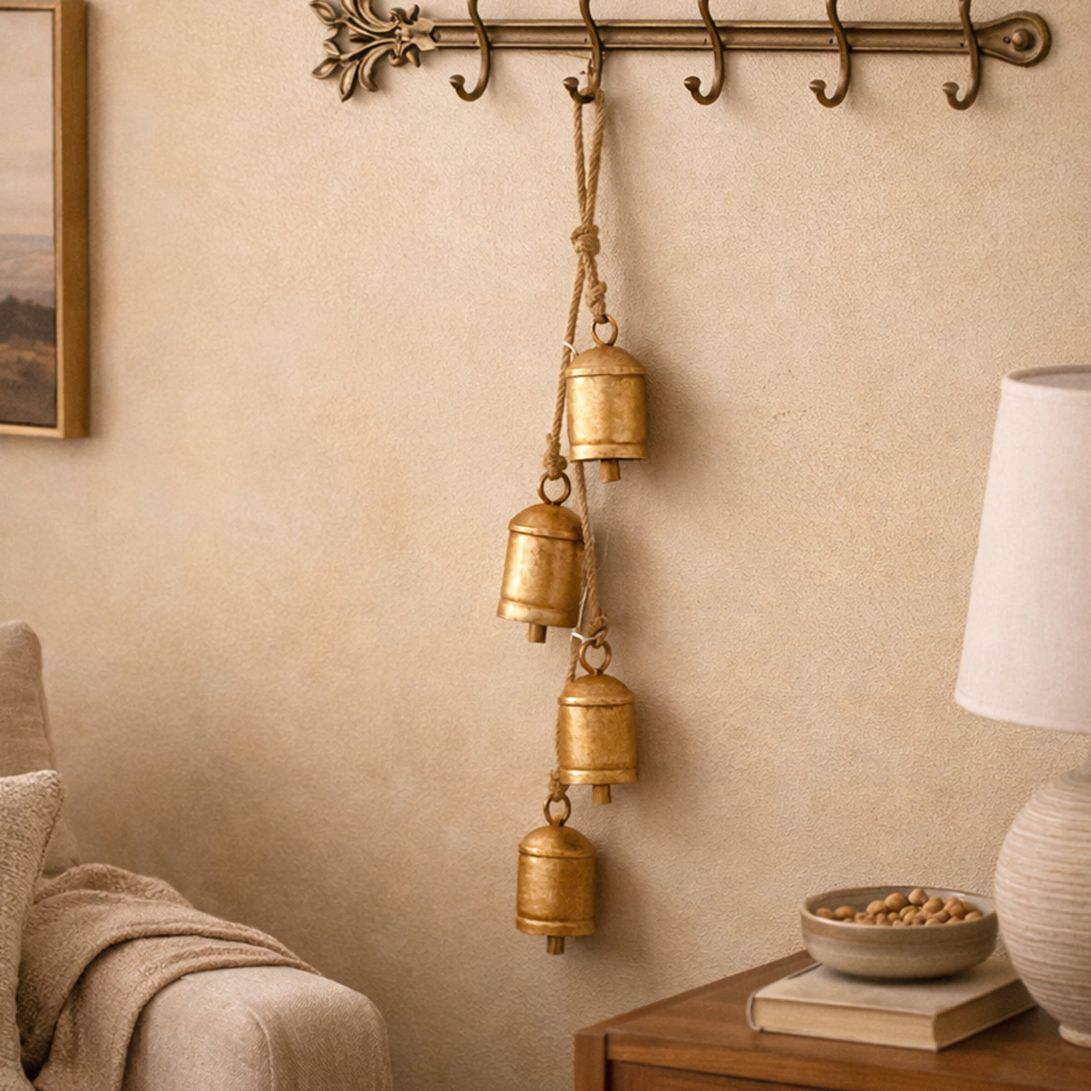 DecMode Tibetan Inspired Cascading Gold Metal Cylindrical Decorative Cow Bells with 4 Bells on Jute Hanging Rope