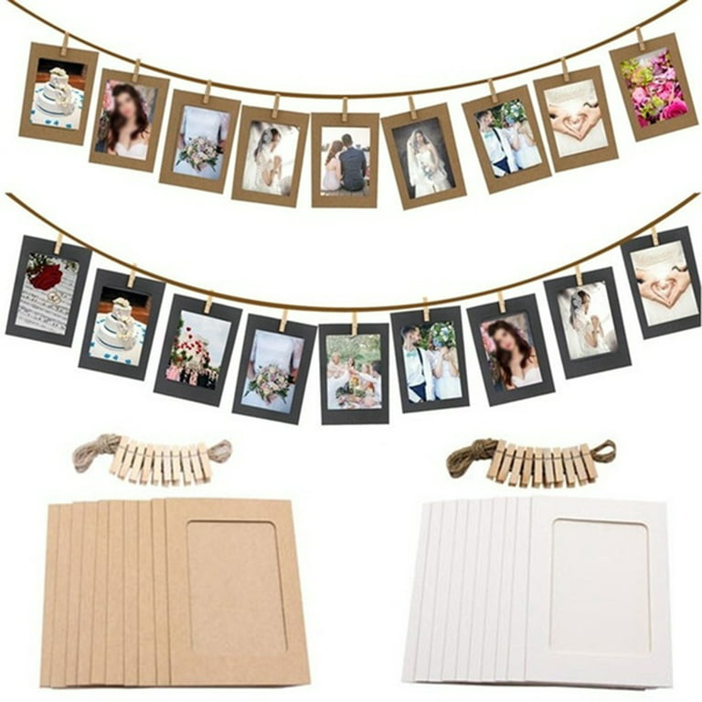 Photo frame hanging on rope. Blank photo paper frames, retro picture e By  YummyBuum