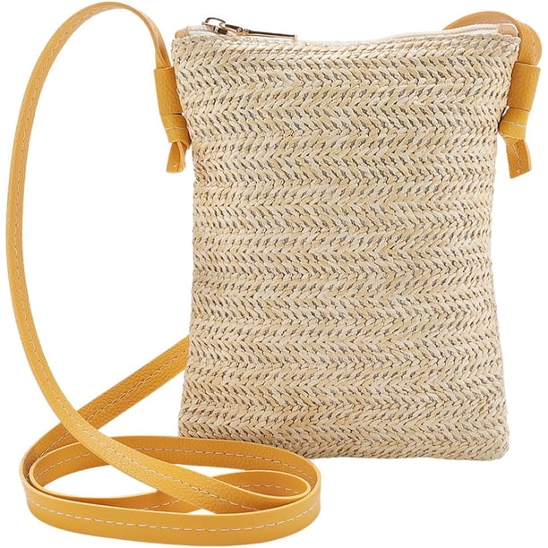 Bolso de mano tipo bandolera de paja tejida con asas de cuero ajustables, cierre de metal y forma de cubo para playa.