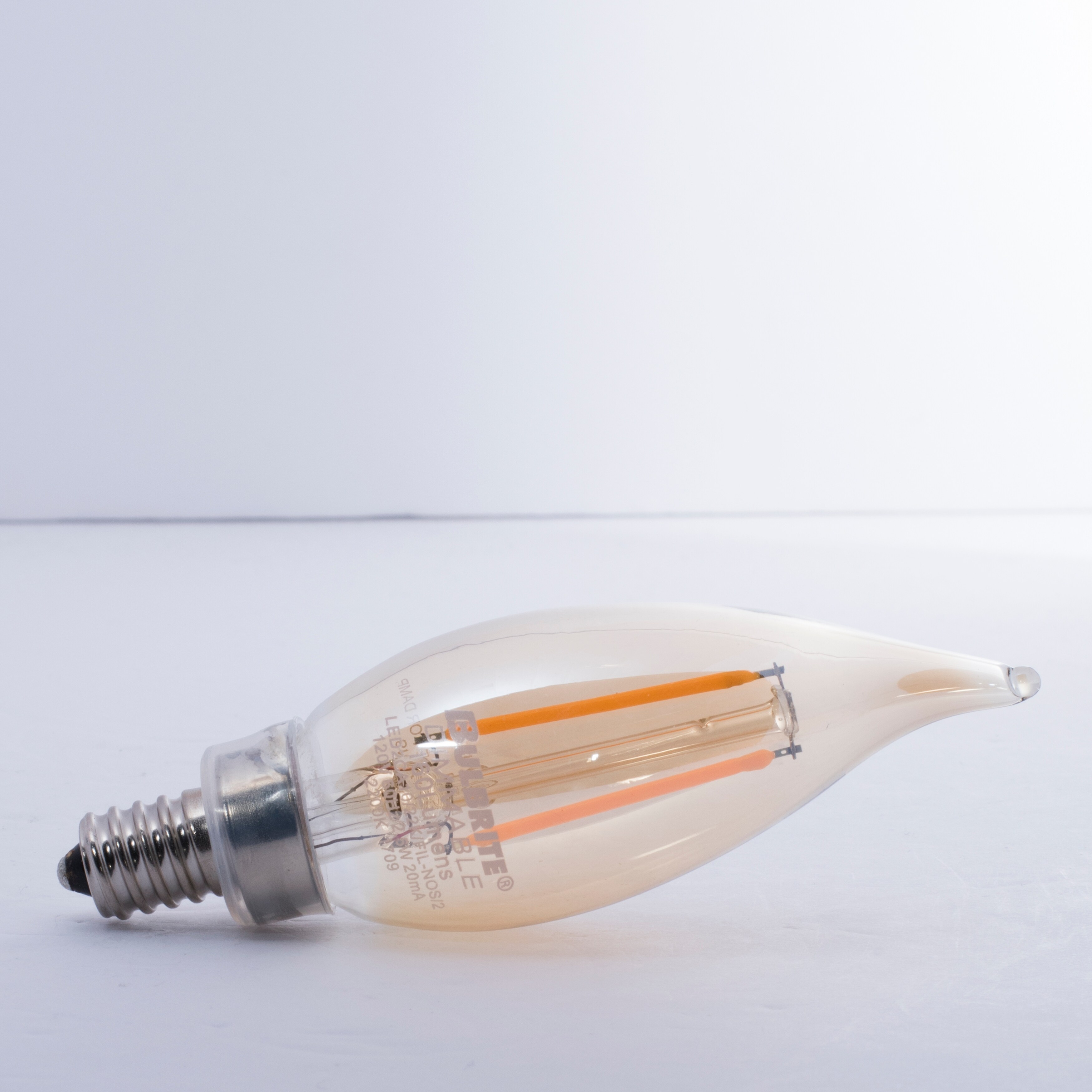 Bulbrite Pack of (4) 2.5 Watt Dimmable Antique Glass Finish CA10 LED Light Bulbs with Candelabra (E12) Base  2100K Amber Light  170 Lumens