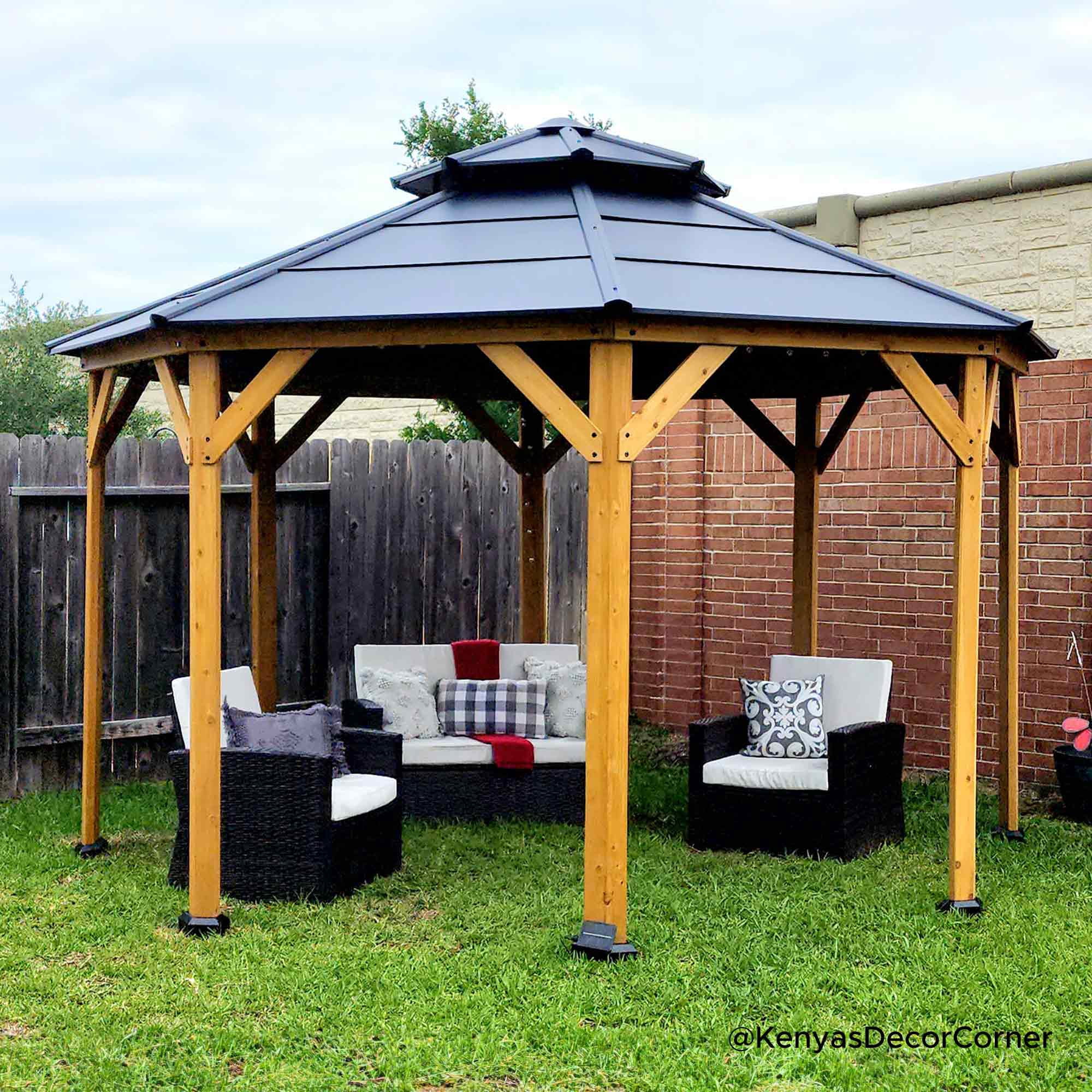 Sunjoy Nebraska Collection 13 ft. x 13 ft. Cedar Framed Octagon Gazebo with Black Steel 2-tier Hardtop Roof