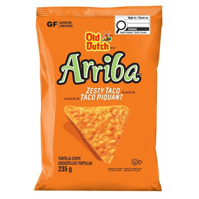 Old Dutch Arriba Zesty Taco Tortilla Chips in a 235 g orange bag showing a large triangular chip, gluten free label, and Health Canada sodium warning, featuring bold taco seasoning and crunchy texture, often used for snacking or party appetizers.
