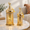 Gold, variant on Sunburst Lantern Set of 2 Metal Decorative Candle Holders for Indoor Outdoor Eid Ramadan Decor