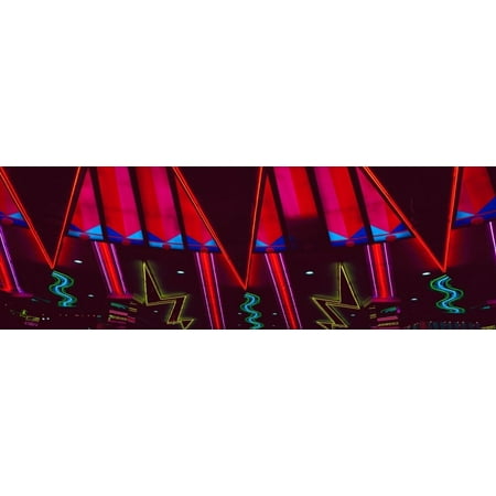 Panoramic view of New York New York hotel and casino and neon lights Las Vegas NV Poster Print