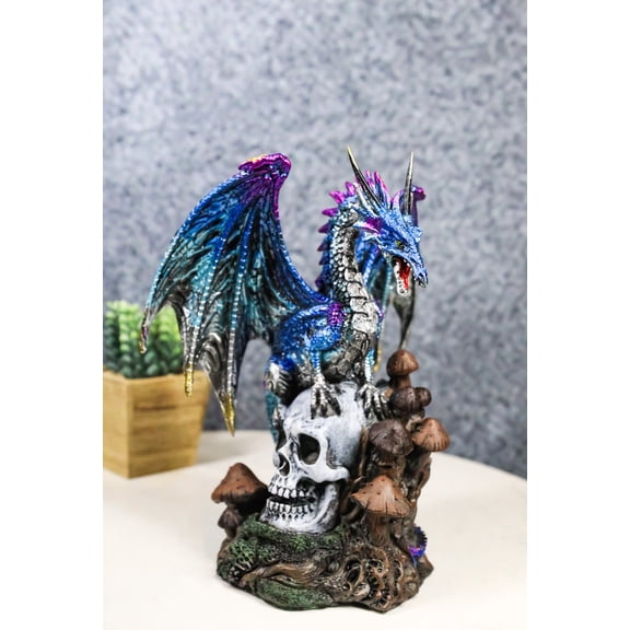Metallic Blue Dragon with Purple Spikes Perching On Oversized Skull Figurine