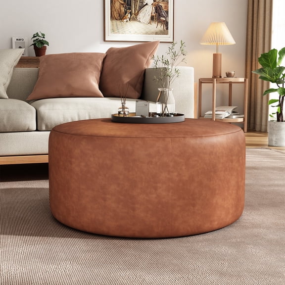 Upholstered Round Ottoman in Cognac Brown