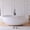 White, variant on MEDUNJESS 63" Premium Wave Solid Surface Stone Resin Freestanding Bathtub, Modern Design Stand Alone Tub Soaking Tub with Overflow and Pop up Drain, Matte White