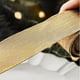 thumbnail image 4 of Cinta Navideña de Seda con Purpurina Dorada de 2 M | Cinta Decorativa Hecha a Mano | Cinta Tejida con Polvo Dorado Reutilizable y Duradera para Decorar Árboles, Envolver Regalos y Hacer Manualidades., 4 of 6