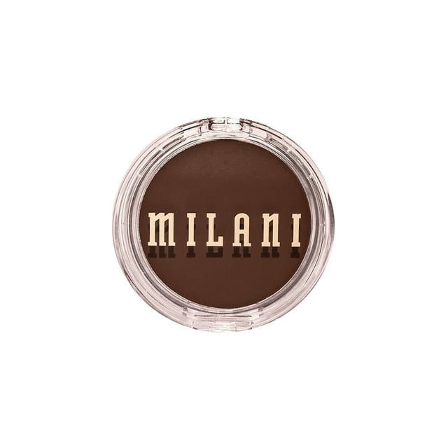 Bronceador Milani cheek kiss cream mocha moment acabado mate 6 g en envase redondo transparente con tapa, color marrón mocha con fórmula ligera y ultramezclable que ofrece cobertura construible y acabado mate natural, enriquecido con vitamina E y aceites nutritivos para cuidar la piel, ideal para dar calidez y un brillo veraniego al rostro, también usado como contorno suave para definir el maquillaje facial.