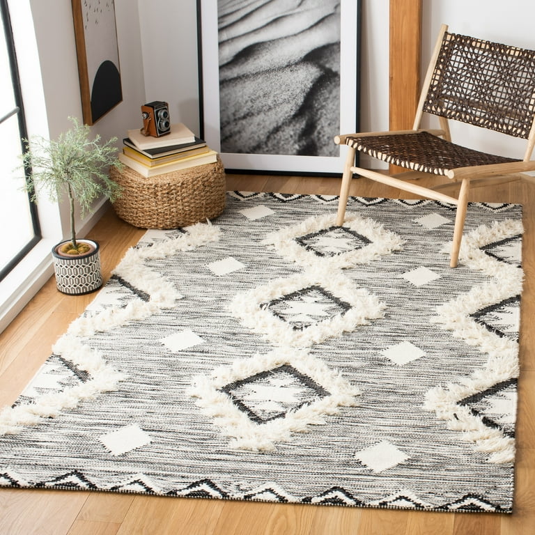 5' x 8' Ivory and Black Southwestern Hand Tufted Non Skid Area Rug 5' x 8' Ivory and Black Southwestern Hand Tufted Non Skid Area Rug