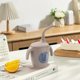 thumbnail image 1 of Vaso de agua de silicona para niños con forma de pingüino - Asas dobles marcadas con pajita, 1 of 5