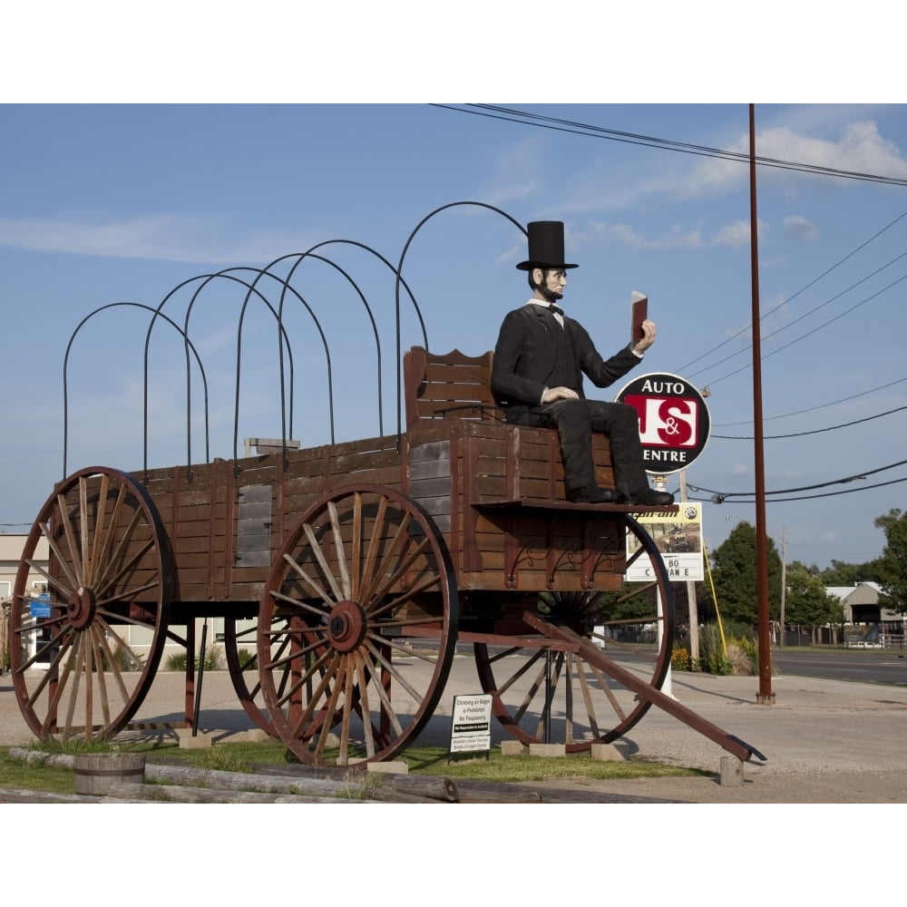 Abe Lincoln sits on a wagon reading a book, Route 66, Lincoln, Illinois