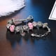 thumbnail image 3 of Pulsera con dije de corazón de cristal rosa con cadena plateada y extensor de 7,5"+1,5", 3 of 5