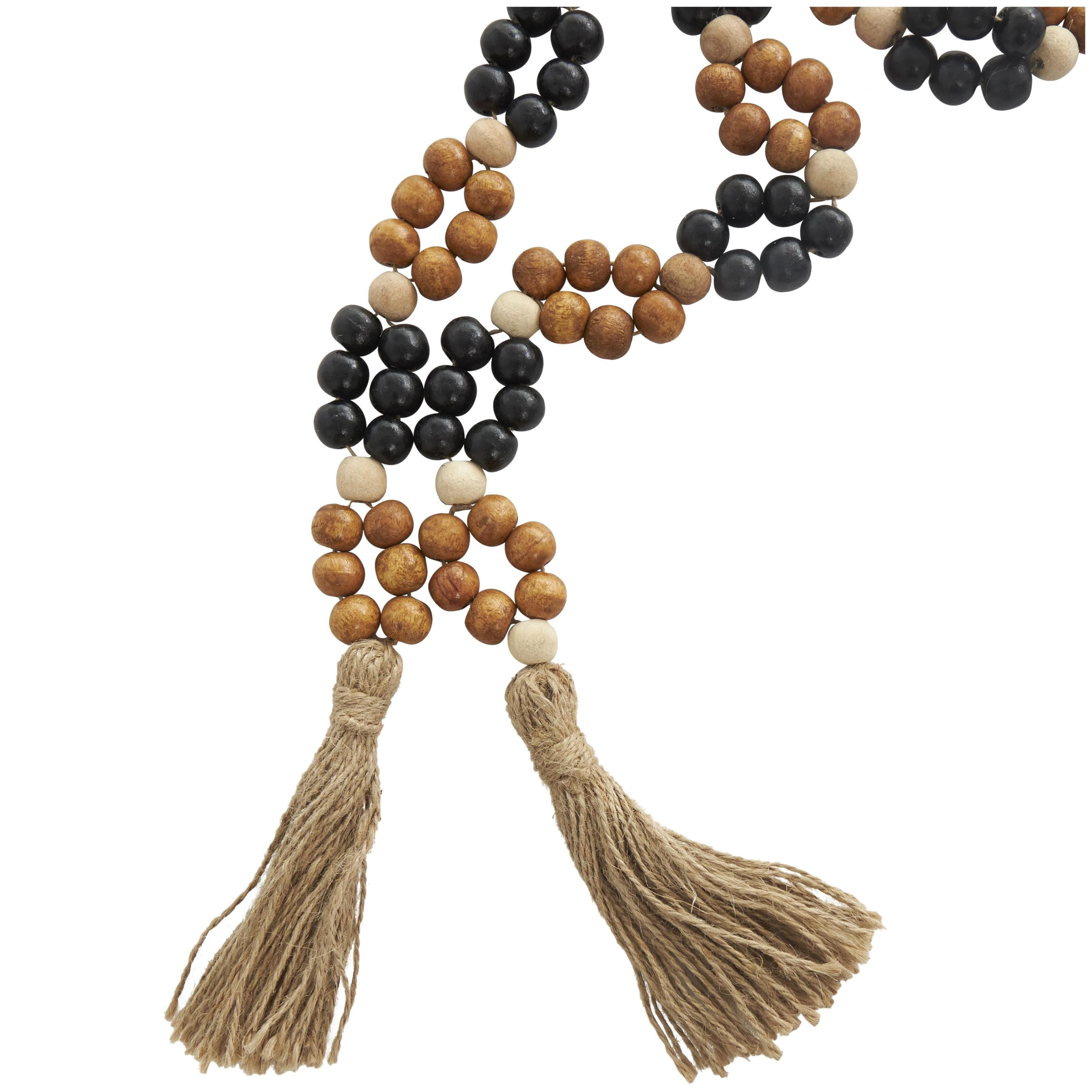 DecMode Handmade Round Double Layered Long Carved Brown Mango Wood Garland with Tassel with Black and Cream Accents