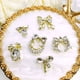 thumbnail image 2 of Lote mixto de joyas de aleación para uñas, con forma de cara sonriente, lazo para uñas, taladro adhesivo, 2 of 5