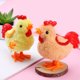 thumbnail image 2 of KAKOWELY 3 piezas de juguetes de cuerda para pollitos de peluche con mecanismo de relojería. Juguete de pollito saltarín con cuerda., 2 of 5