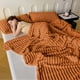thumbnail image 5 of Manta de franela polar a rayas de microfibra acanalada para sofá, acogedora, cálida y cómoda para todas las estaciones, ideal para dormitorio, sala de estar y uso familiar. Aestivo | Naranja, 5 of 7