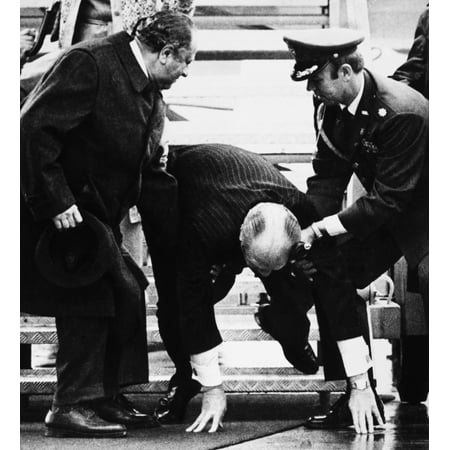 Gerald Rudolph Ford N(1913-2006) 38Th President Of The United States Being Assisted By A Military Aide And Austrian Chancellor Bruno Kreisky (Left) After Stumbling Down The Steps Of Air Force One On H