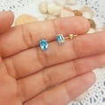 thumbnail image 3 of Dazzlingrock Collection 7x5 mm Oval Cut Blue Topaz Solitaire Stud Earrings for Women (Color Blue, Clarity Moderately Included) in 10K Yellow Gold, 3 of 5
