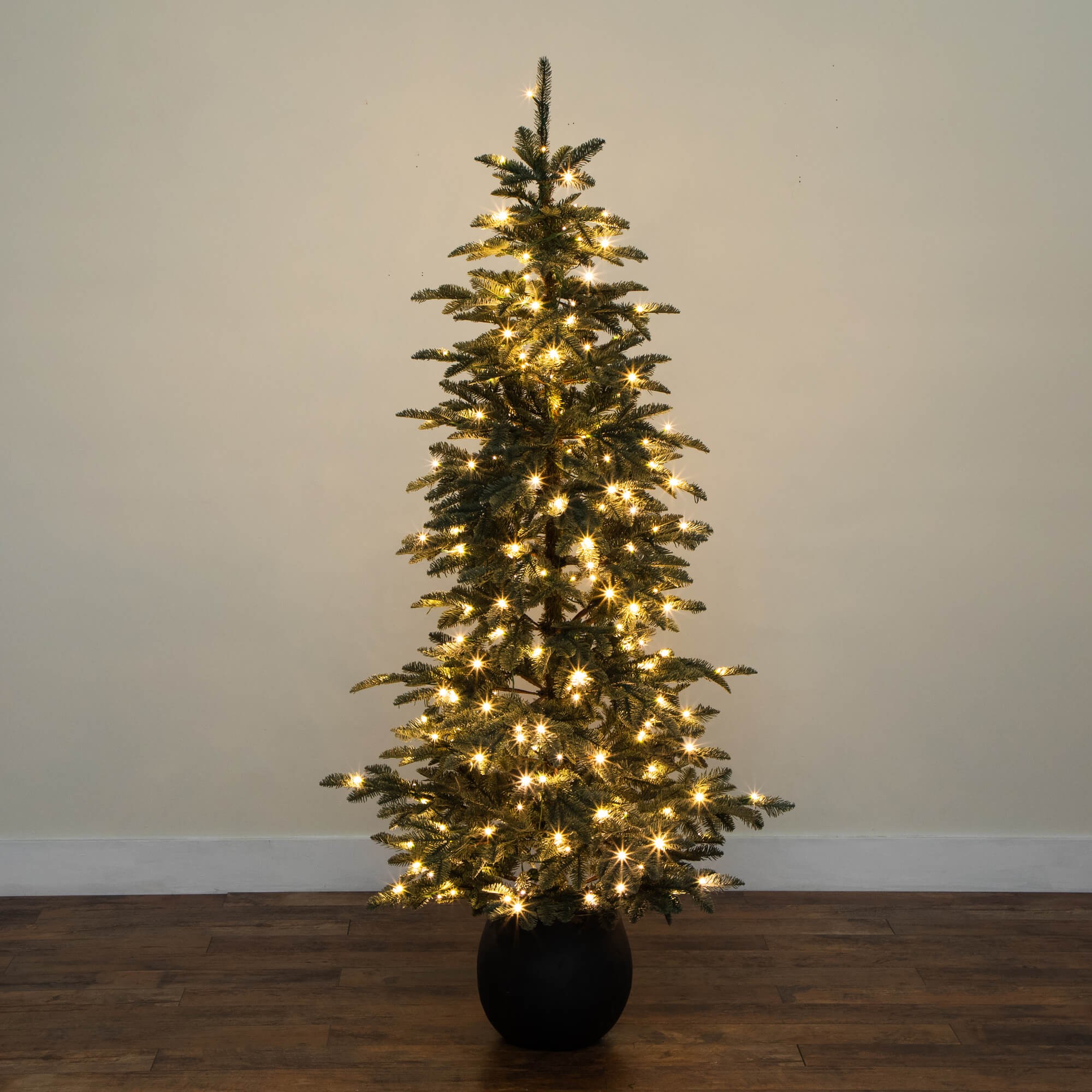 Nearly Natural 6ft. Pre-Lit Artificial Pine Christmas Tree in Round Black Decorative Planter with 60 Warm White LED Lights