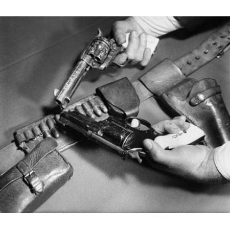Close-up of mans hands holding a 45 Caliber Colt Army Revolver with a Smith and Wesson 357 Magnum Revolver Canvas Art -  (18 x