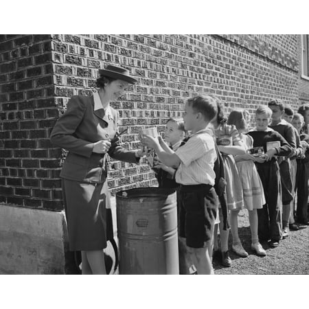 Girls Grease - Boys and girls collect fats and greases then turn it over to school authorities circa 1942 Poster Print by Stocktrek Images