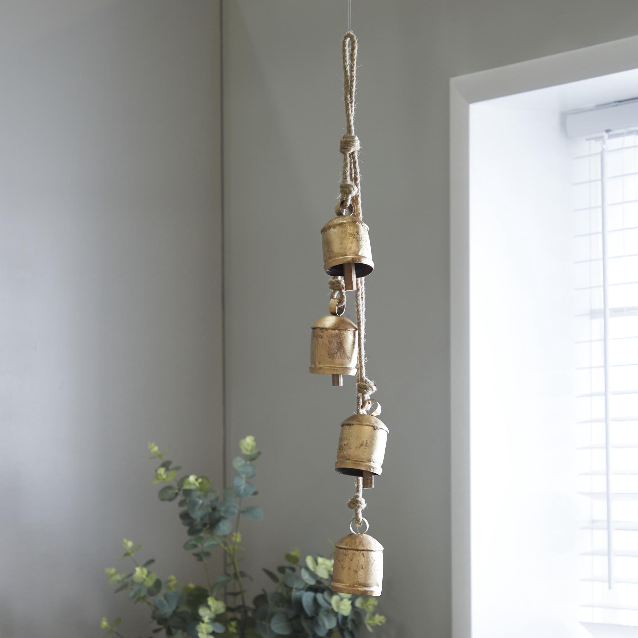 DecMode Tibetan Inspired Cascading Gold Metal Cylindrical Decorative Cow Bells with 4 Bells on Jute Hanging Rope