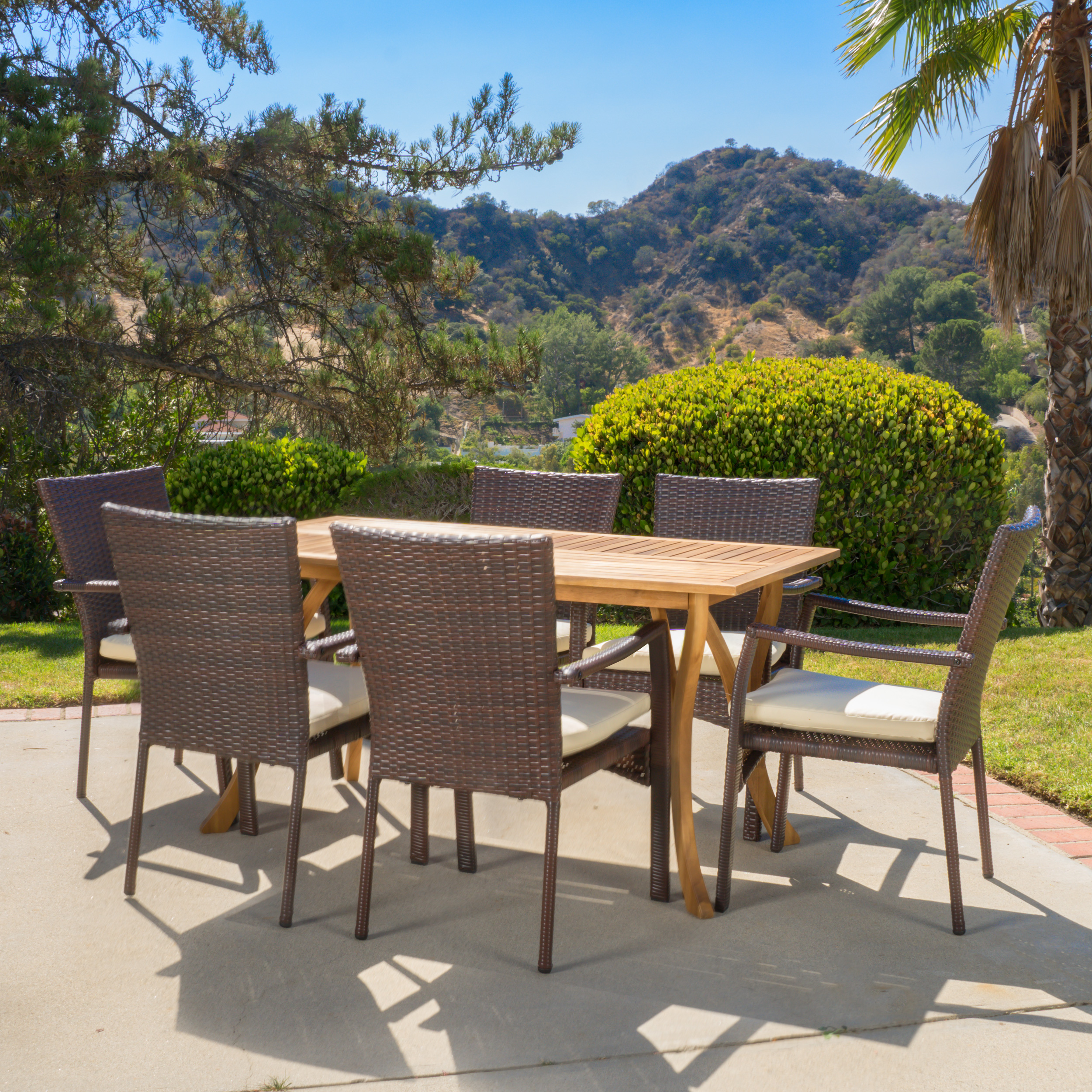 Noble House Ruiz 7 Piece Outdoor Wicker and Acacia Wood Dining Set with Cushions, Teak Finish/Creme