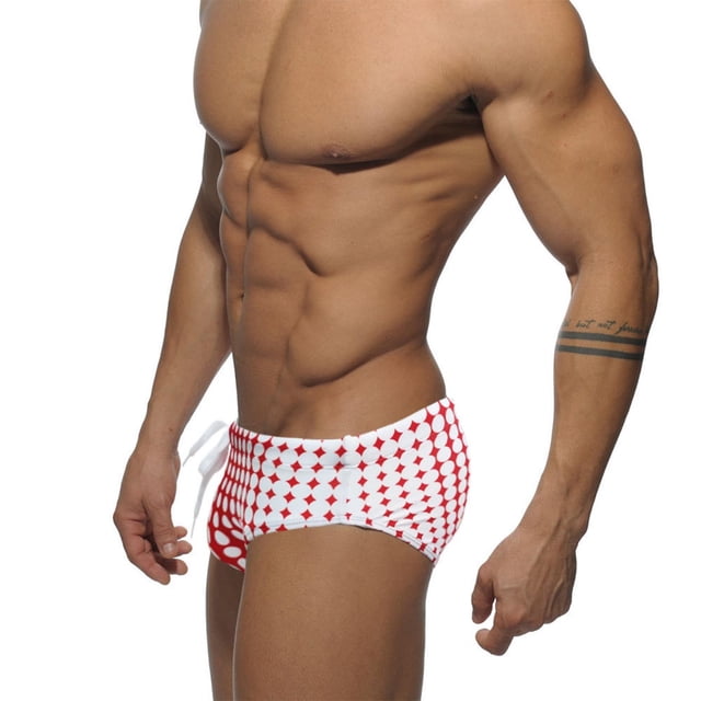 Bañador ajustado de hombre con estampado de lunares multicolor degradado, ideal para vacaciones en la playa.