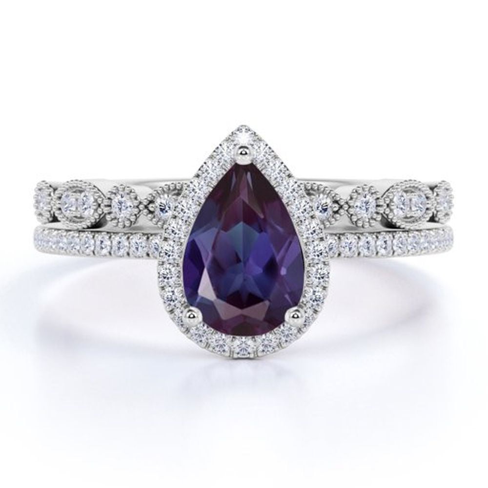 JeenMata Halo 1.5 Pear Cut Lab Created Alexandrite and Moissanite Mismatched Wedding Ring Set - Scalloped Wedding Band - 18k White Gold over Silver