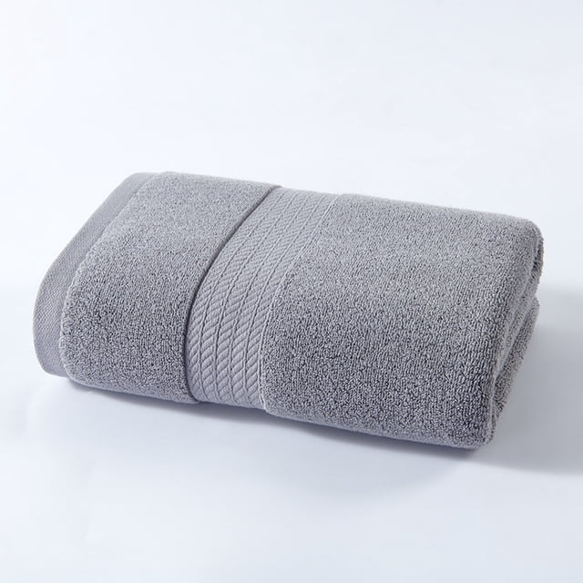 toalla de baño extragrande para adultos, 220 gramos, color liso, absorbente, para el rostro — toalla plegada en vista 3/4 frontal, extra grande 50×100 cm, gris liso; rizo de alta densidad visible, banda tejida en el borde y textura suave sin pelusas; grosor 220 g visible, adecuada para secar rostro y cuerpo; a menudo usada también como toalla de invitado plegada.