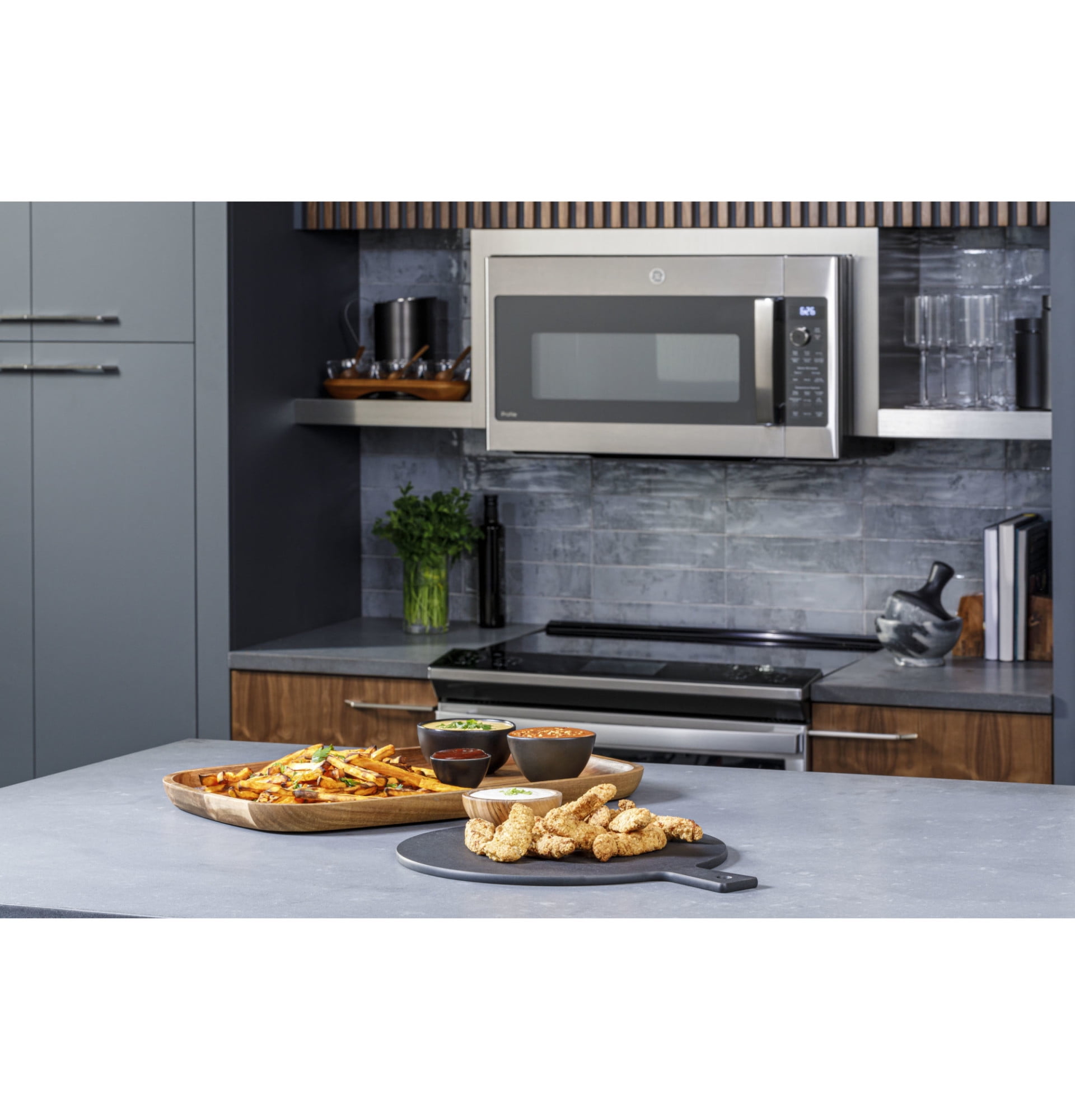 General Electric 1.7 cu ft 75 lb Over The Range Microwave Ovens