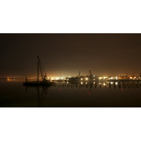 Brass Pier Base LAMINATED POSTER New pilings for a reconstructed Pier 12 can be seen with ships in the background at Naval Base San D Poster Print 24 x 36 ()