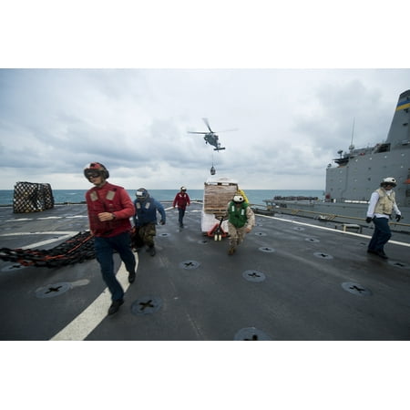 LAMINATED POSTERSailors race to get cargo pallets off the flight deck of the amphibious dock landing ship USS Harpe Poster Print 24 x (Best Way To Get Paint Off Wood Deck)