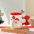 thumbnail image 1 of Taza navideña de cerámica con tapa y cuchara | Diseño alegre con Santa y reno | Mango en lazo decorativo | Capacidad generosa para café, chocolate caliente o postres | Resistente y colorido, 1 of 6