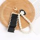 thumbnail image 1 of LLavero de amor negro Retro para mujer y niña, colgante nacarado con lazo, funda para auriculares, adorno, llaveros, regalo para pareja, 1 of 4