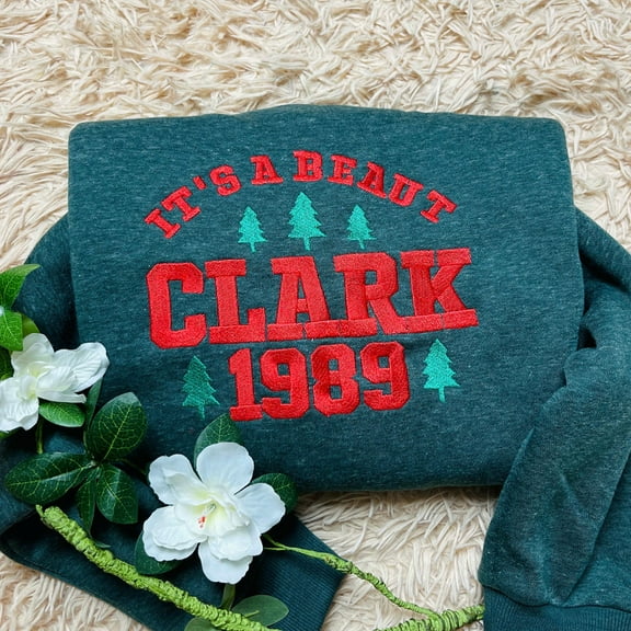 It’s a Beaut Clark Embroidered Sweatshirt: Funny Griswold Christmas Crewneck | Holiday Party Outfit | Xmas Gift Shirt for Family & Friends