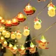 thumbnail image 2 of Nueva cadena de luces LED navideñas con luces intermitentes, para el día de Navidad, con personajes de dibujos animados, muñeco de nieve, ambiente decorativo, 2 of 5