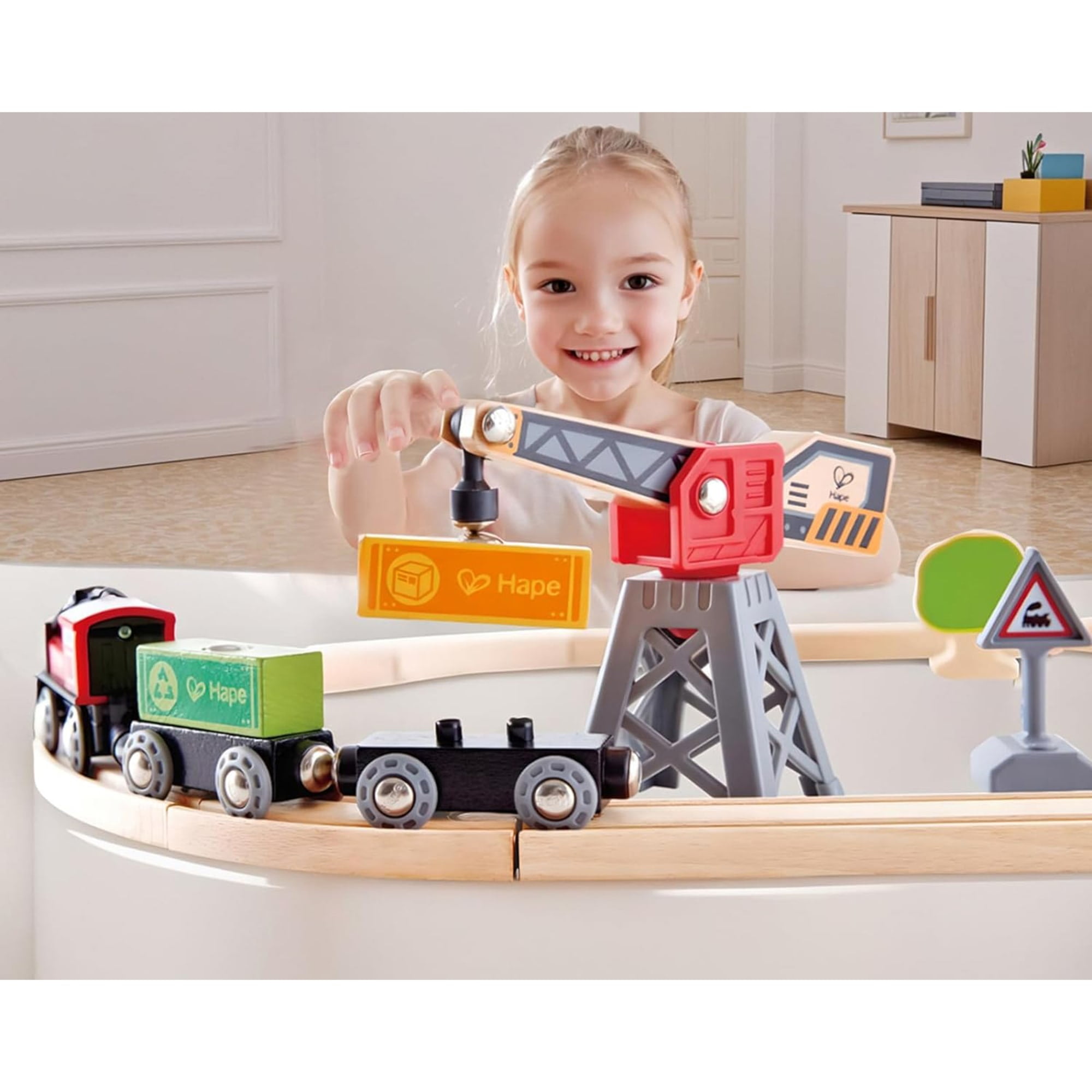 Hape: Cargo Delivery Loop - Battery Powered Engine, Oval Track Railway Set, Wooden Toy, 3 Magnetic Linking Trains, Crane, Accessories, Kids Ages 3+