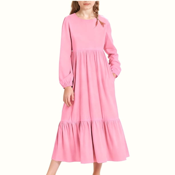 Vestido infantil de poliéster de manga larga, cuello redondo, bolsillos laterales y falda larga.