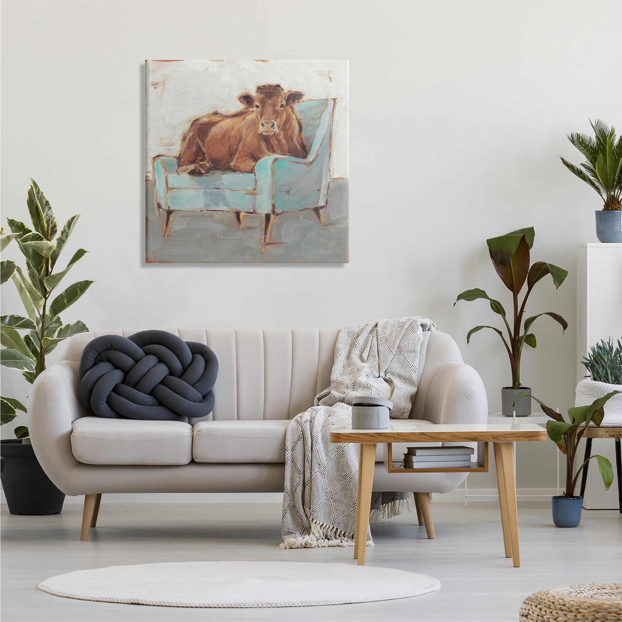 The Stupell Home Decor Brown Bull on a Blue Couch Neutral Color Painting Canvas Wall Art