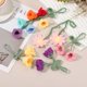 thumbnail image 4 of Accesorio colgante de coche de ganchillo, adorno hecho a mano con 2 lindas flores de lirio de los valles para decoración de coche, llavero, blanco, 4 of 6