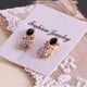 thumbnail image 4 of Pendientes de oreja de gato Fernando Bowknot de lindo gato brillante oro y negro, 4 of 7