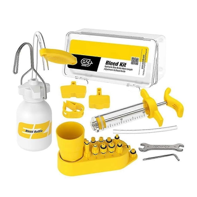 kit de purga de frenos de bicicleta para frenos de disco hidráulicos shimano, juego de herramientas de purga con botella de llenado y embudo, jeringa graduada, soporte con varios adaptadores, llaves y tapas en ABS amarillo y blanco; vista frontal sobre fondo blanco, para cambio de aceite en bicicletas de montaña y de ruta; apto también para transportar pequeñas cantidades de líquido de freno en salida.