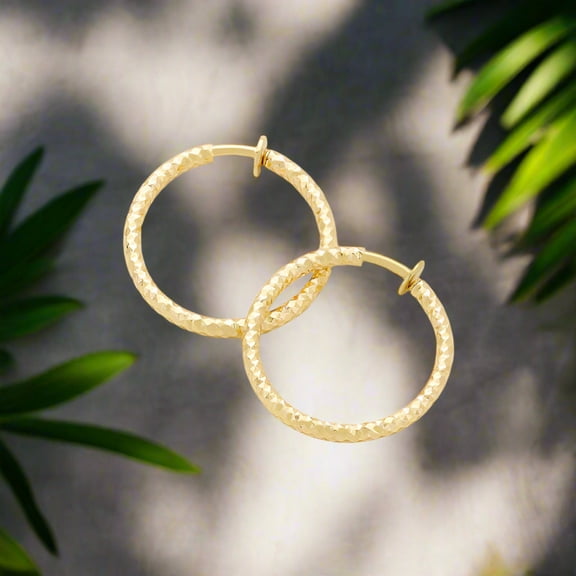 Clip on 1 1/4" gold textured spring back hoop earrings